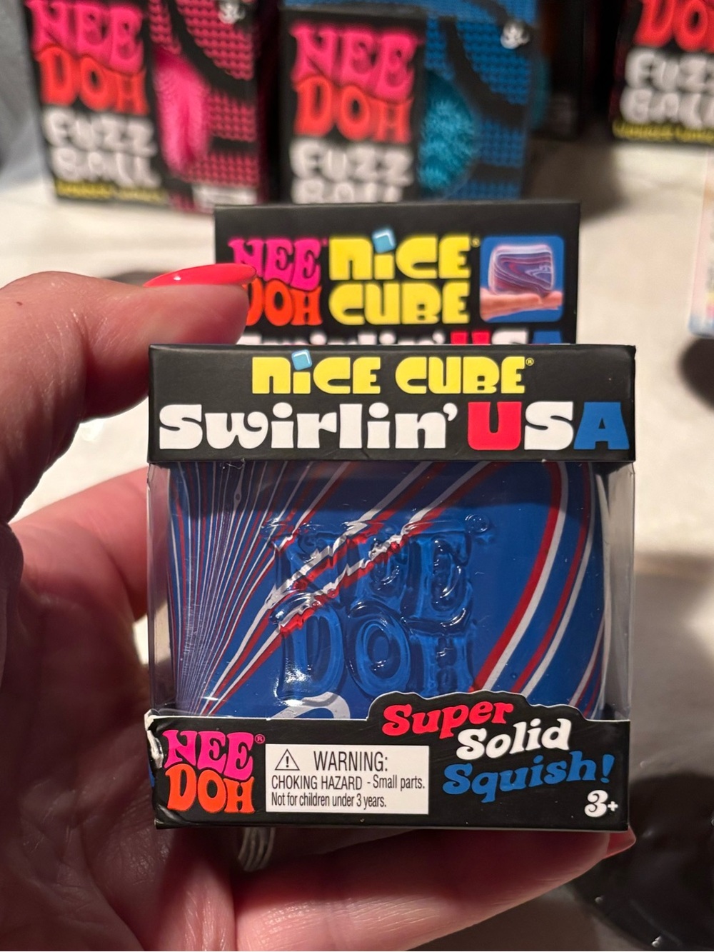 Nice Cube Swirlin' USA NeeDoh Squish Toy - Blue with Red & White Swirls